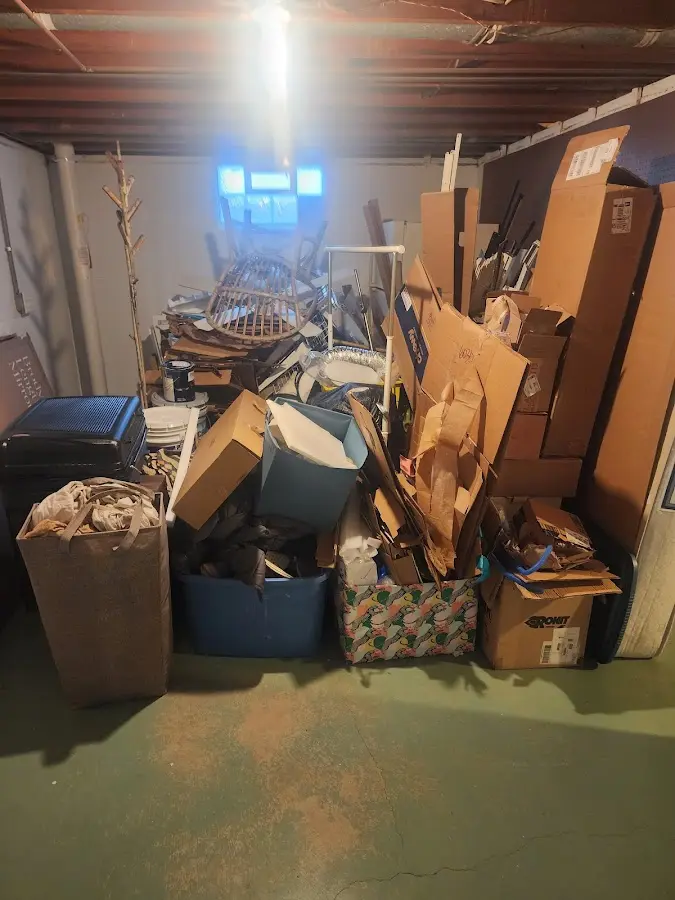 Roll-off dumpster container at job site for 2 Yard Dumpster Rental in Malabar